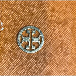 Tory Burch orange glasses case.